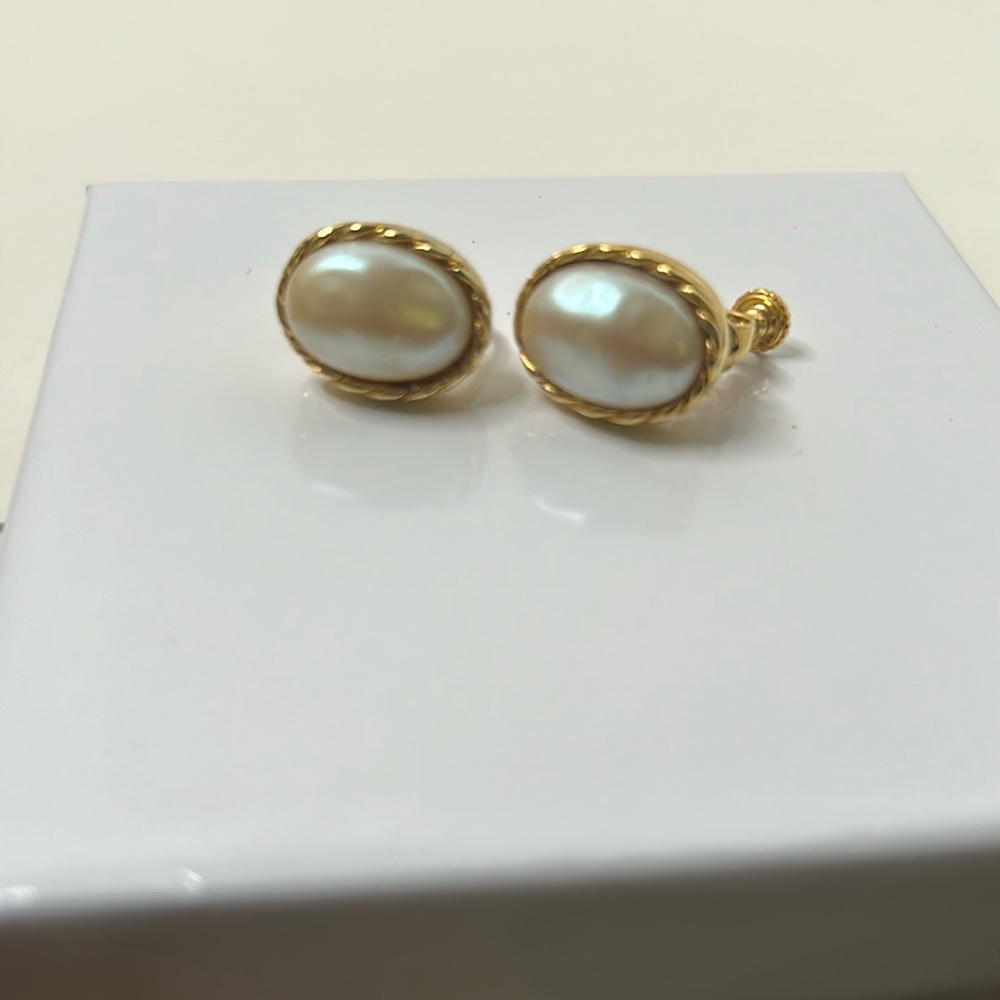 Napier pearl gold tone clip earrings twist trim design
